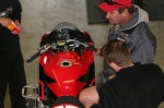 Aaron Gobert and crew working on his bike